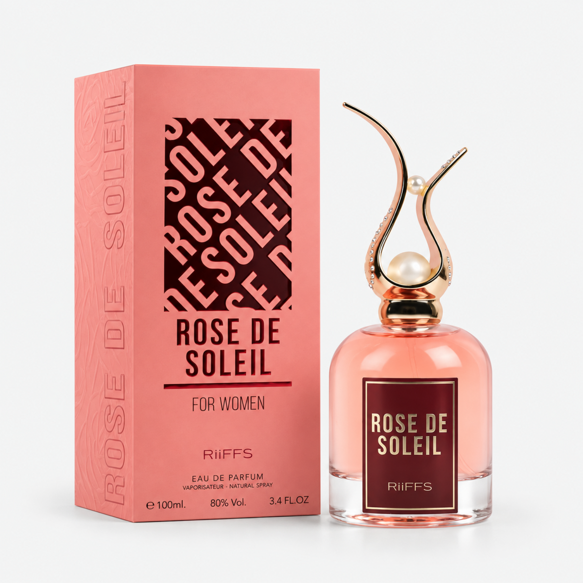 RiFFS Rose de Soleil Eau de Parfum for women, shown with its pink packaging box and the clear glass perfume bottle. The bottle features a pink liquid, a gold and silver sculptural cap with a pearl, and a dark pink label.