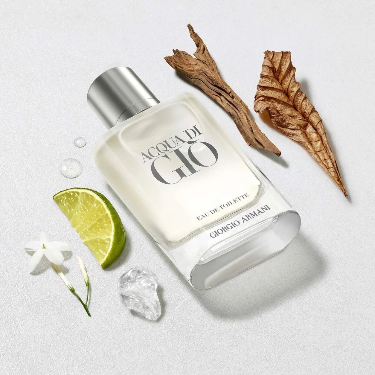 Giorgio Armani Acqua di Gio perfume bottle with decorative elements on a light background