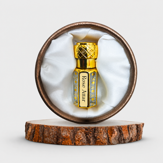Gold and bronze bottle labeled 'Rose Altar' on a wooden platform with white background